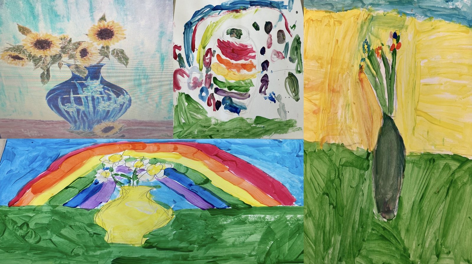 Students' watercolor paintings laid out on a table