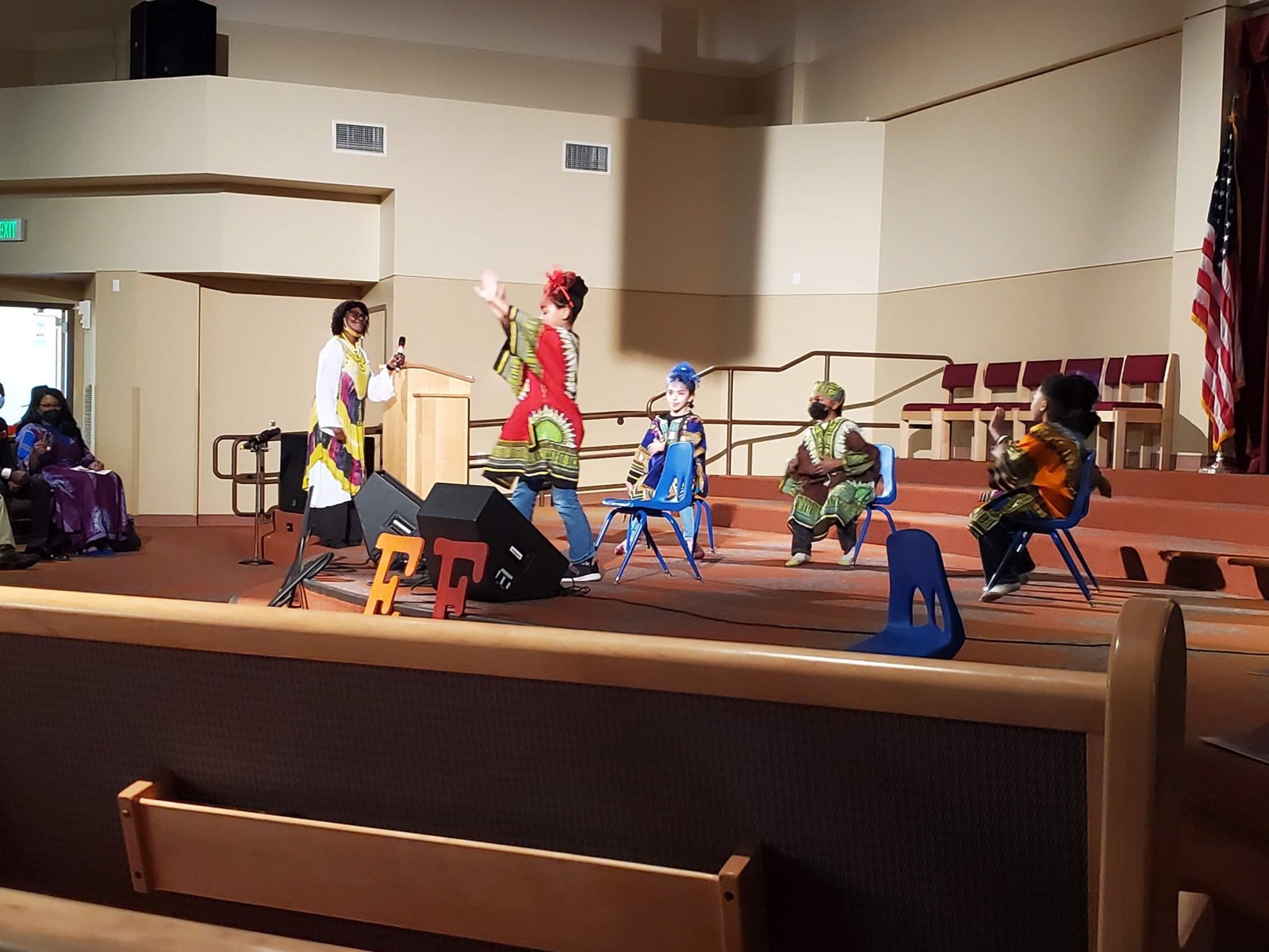 Performers on the stage of the hall during a festival